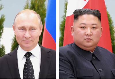 写真：ロシアのプーチン大統領（左）、北朝鮮の金正恩朝鮮労働党総書記（いずれも朝鮮通信＝共同）