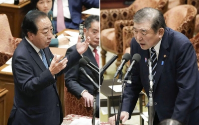 写真：衆院予算委で立憲民主党の野田代表（左）の質問に答える石破首相。「高額療養費制度」の利用者負担上限を引き上げる政府方針を見直す意向を表明した＝２８日午後